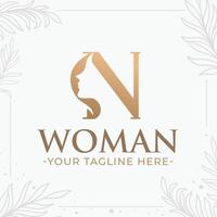 Beautiful letter N monogram logo with woman silhouette vector
