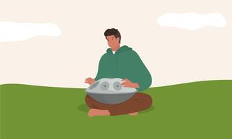 un hombre sentado en el césped jugando un handpan vector