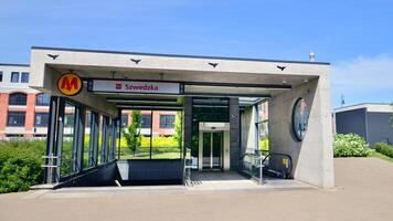 Warsaw, Poland. 3 May 2024. Second line of Warsaw Subway system. The entrance of a subway station. Warsaw Szwedzka photo