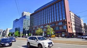 Warsaw, Poland. 11 April 2024. Car traffic at rush hour in downtown area of the city. City center with cars and buildings in the background. photo