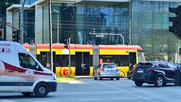 Warsaw, Poland. 11 April 2024. Car traffic at rush hour in downtown area of the city. City center with cars and buildings in the background. photo