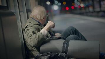 Elderly Homeless Man Suffering from Poverty Looking for Help at Train Station video