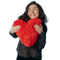 Woman hugging red heart pillow, transparent background png