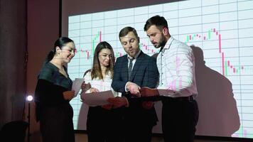 Group of businesspersons meeting in the office with cryptocurrency chart on background. Business and technology concept. Financial technology. Fintech video