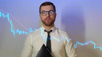 Confident professional businessman looking in camera with stock trade or cryptocurrency graph in background video