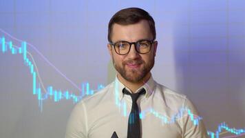 Confident professional businessman looking in camera with stock trade or cryptocurrency graph in background video