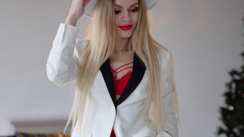 Fashionable and stylish woman in white hat, jacket and red bra with red lips makeup. Fashion look, beauty and style video