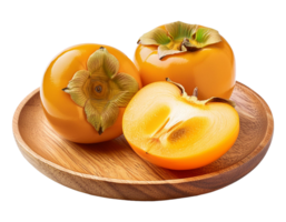 Whole and cut fresh persimmons on a wooden plate png