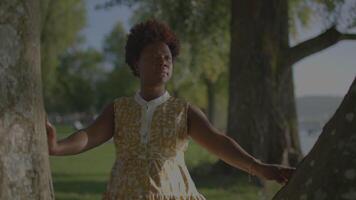 Lifestyle Portrait of Female Person with Curly Hair Enjoying Spring Weather video