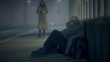 Kind Woman Helping Sad Elderly Homeless Man Outside In Cold Night video