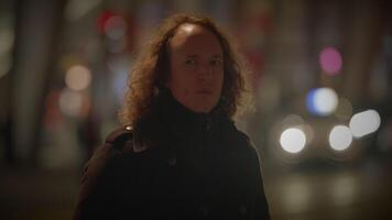 Man with Long Curly Hair Commuting Inside Train Station Watching People video