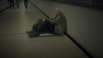 Elderly Homeless Man Suffering from Poverty Looking for Help at Train Station video