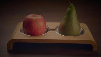 Fresh apple and pear on wood tray, adding sophistication to food projects video