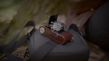 Young Man Taking a Picture with Old Vintage Camera Outside video