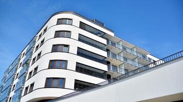 Condominium and apartment building with symmetrical modern architecture in the city downtown. photo