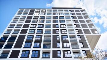 Condominium and apartment building with symmetrical modern architecture in the city downtown. photo