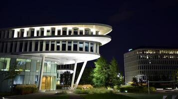 Pattern of office buildings windows illuminated at night. Glass architecture ,corporate building at night - business concept. photo