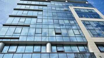 Urban abstract - windowed wall of office building. Detail shot of modern business building in city. photo