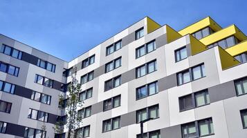 Condominium and apartment building with symmetrical modern architecture in the city downtown. photo