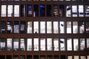 Modern office building at night. Night lights, city office building downtown, cityscape view photo