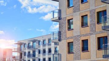 Modern apartment building in sunny day. Exterior, residential house facade. Residential area with modern, new and stylish living block of flats. photo