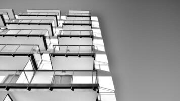 fragmento de un fachada de un edificio con ventanas y balcones moderno Departamento edificios en un soleado día. fachada de un moderno Departamento edificio. negro y blanco. foto