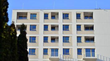 Modern architecture of urban residential apartment building. Apartment building exterior, residential house facade. photo