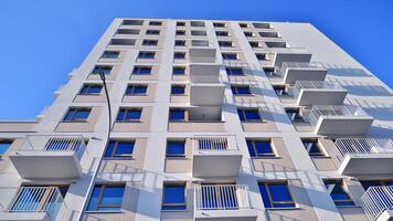 Modern architecture of urban residential apartment building. Apartment building exterior, residential house facade. photo