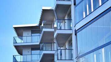 Modern architecture of urban residential apartment building. Apartment building exterior, residential house facade. photo