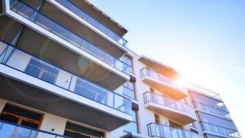 Modern architecture of urban residential apartment building. Apartment building exterior, residential house facade. photo