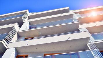 Modern architecture of urban residential apartment building. Apartment building exterior, residential house facade. photo