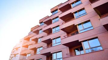 Modern architecture of urban residential apartment building. Apartment building exterior, residential house facade. photo