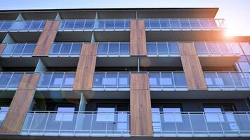 Modern architecture of urban residential apartment building. Apartment building exterior, residential house facade. photo