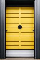 a black and yellow industrial building with a door photo