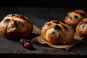 hot cross buns on a black background photo