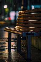 un banco es sentado en el lluvia a noche foto