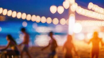 Defocused People is having a beach party at night in the summer event festival vacation on a blurred background photo