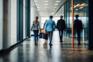 Defocused people walking in modern office building in motion blur photo