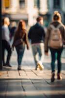 Defocused people walking in the street in motion blur photo
