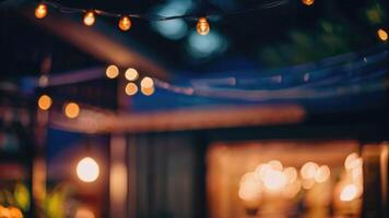 DDefocused restaurant with outdoor string lights on a blurred background photo