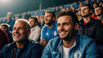 Happy men watching football matches in football stadiums photo