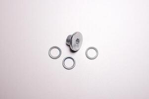 Threaded plug and lip seal for automatic transmission. A part for car maintenance and repair photo