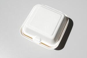 White cardboard box for bento cake to take away, highlighted on a white background photo
