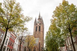 The Netherlands, Delft, October, 2022. The old church in Delft against the background photo