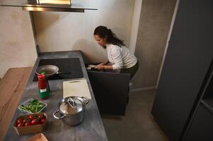 High angle view of a housewife cooking dinner at home kitchen. photo
