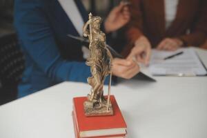 Lawyer, legal advisor, businessman brainstorming information on agreement details Business contracts in legal processing books for accuracy in contract documents. joint financial investment. photo