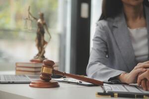 Lawyer, legal advisor, businessman brainstorming information on agreement details Business contracts in legal processing books for accuracy in contract documents. joint financial investment. photo