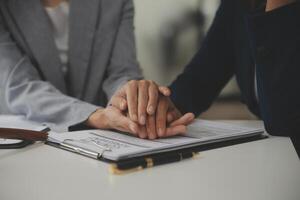 Lawyer, legal advisor, businessman brainstorming information on agreement details Business contracts in legal processing books for accuracy in contract documents. joint financial investment. photo