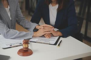 Lawyer, legal advisor, businessman brainstorming information on agreement details Business contracts in legal processing books for accuracy in contract documents. joint financial investment. photo