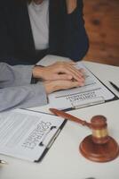 Lawyer, legal advisor, businessman brainstorming information on agreement details Business contracts in legal processing books for accuracy in contract documents. joint financial investment. photo